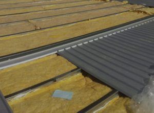 Purlin bridging and insulation system