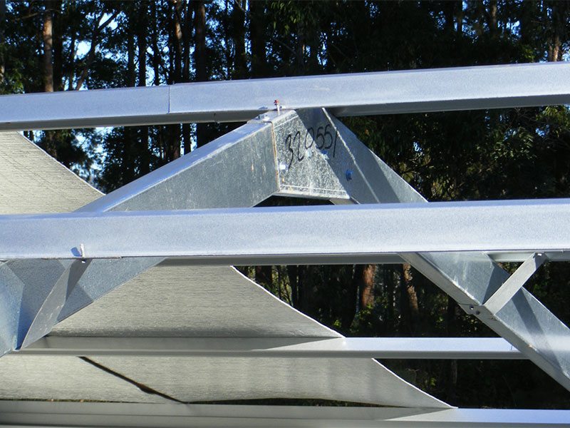 Photo of top hats on a roof during construction.