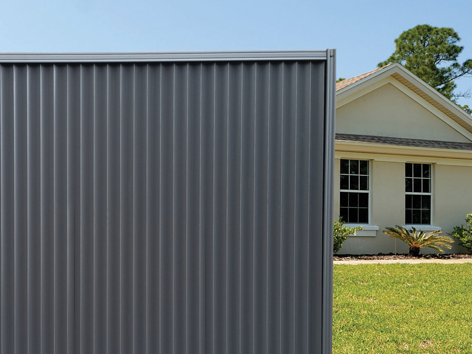 Installed Gemini fence panel with house in background