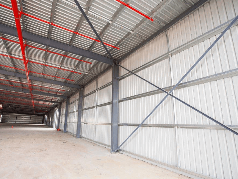 Photo of Trimclad installed as roofing and walling in a large shed.